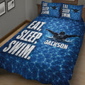 Swimming quilt bedding set with swimmer illustration, blue water texture and bold white typography
