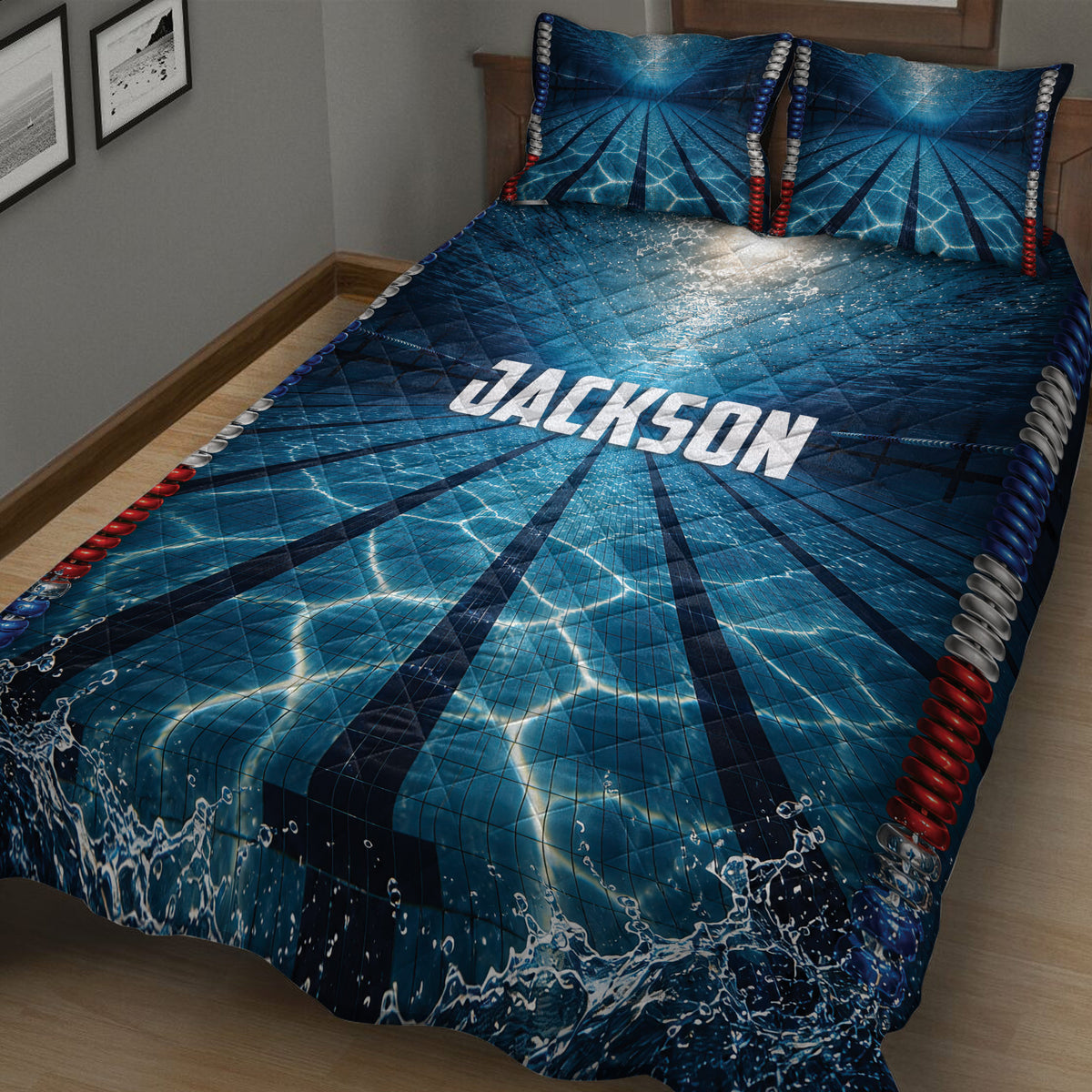 Close bedroom view of blue swimming pool lane quilt bedding with dramatic water and splash graphics