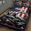 Close bedroom view of a swimming quilt blanket featuring a freestyle swimmer, stars, and dramatic water artwork