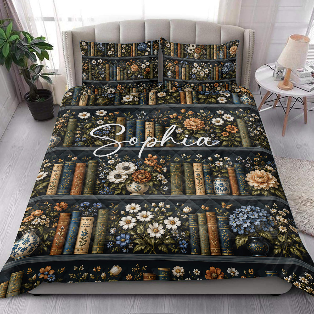 Literary floral quilt bedding styled on a bright bedroom bed with matching book-patterned pillows