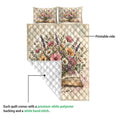 Book quilt blanket showing the printed floral artwork and white diamond-stitched reverse side
