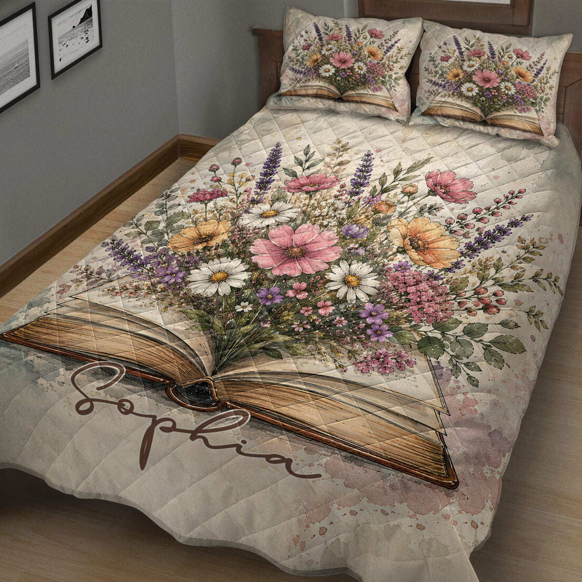Close bedroom view of a floral book quilt blanket featuring an open book and botanical artwork
