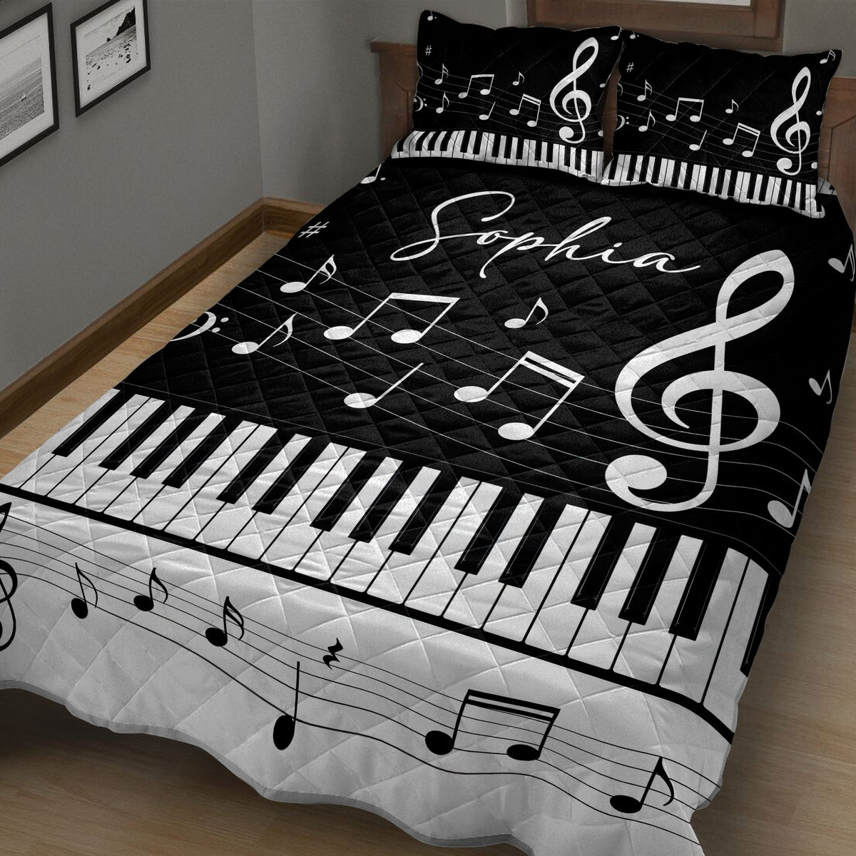 Close bedroom view of a black and white piano quilt blanket with musical notes and keyboard pattern