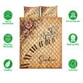 Piano quilt bedding set shown with musical artwork, floral accents, and product feature icons