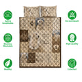 Great Pyrenees quilt blanket shown front-facing with dog portraits, paw print accents, and illustrated mountain panels