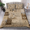 Great Pyrenees quilt blanket styled on a bedroom bed with large dog portraits and rustic paw print details