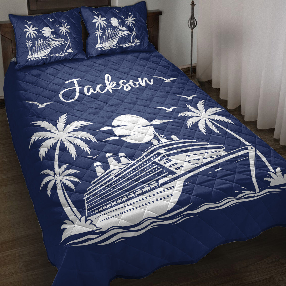 Navy cruise ship quilt blanket displayed on a bed with palm trees, moonlight, waves, and seagulls