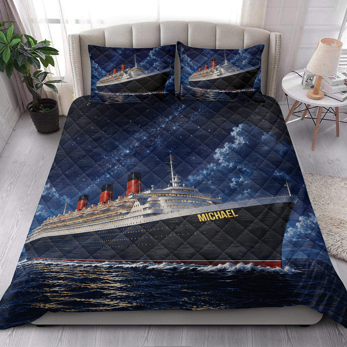 Cruise ship quilt blanket styled on a bedroom bed with ocean liner artwork