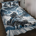 Snowmobile quilt bedding displayed on a bed with blue mountain scenery and rider artwork