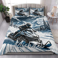 Snowmobile quilt bedding styled in a bright bedroom with snowy mountain and rider artwork