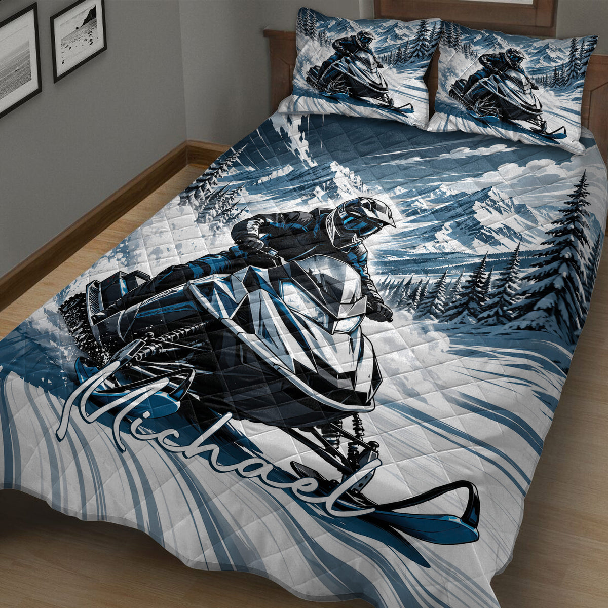 Snowmobile quilt spread across a bed with bold blue mountain landscape and winter riding artwork