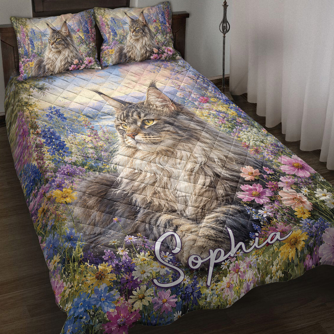 Maine Coon quilt blanket spread across a bed with a large cat portrait and colorful wildflower meadow