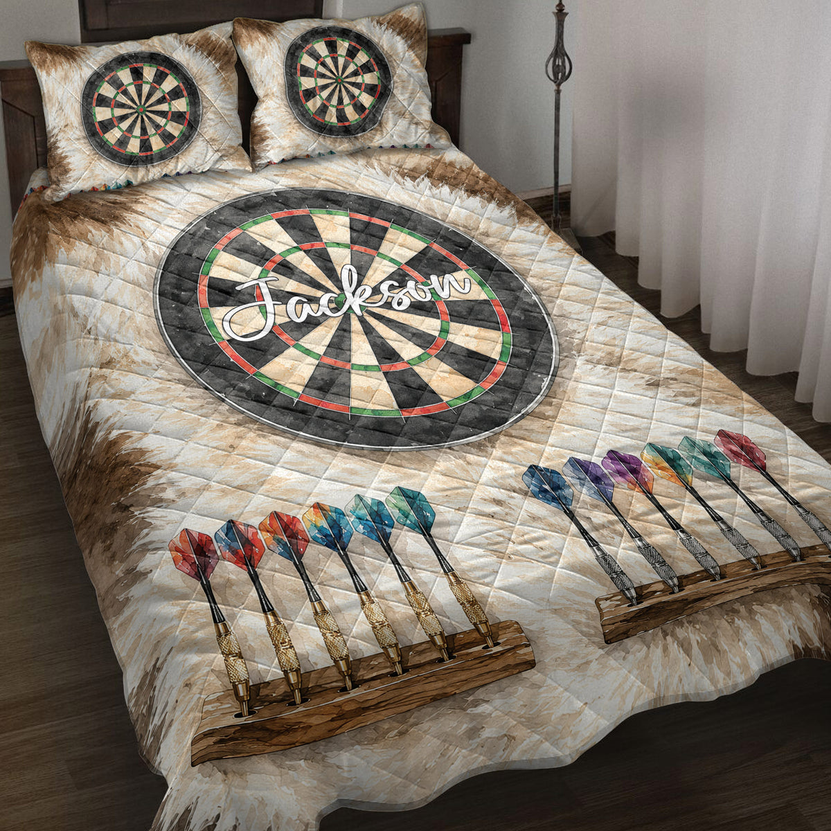 Dart board quilt blanket styled on a bed with colorful darts and matching dartboard pillow designs