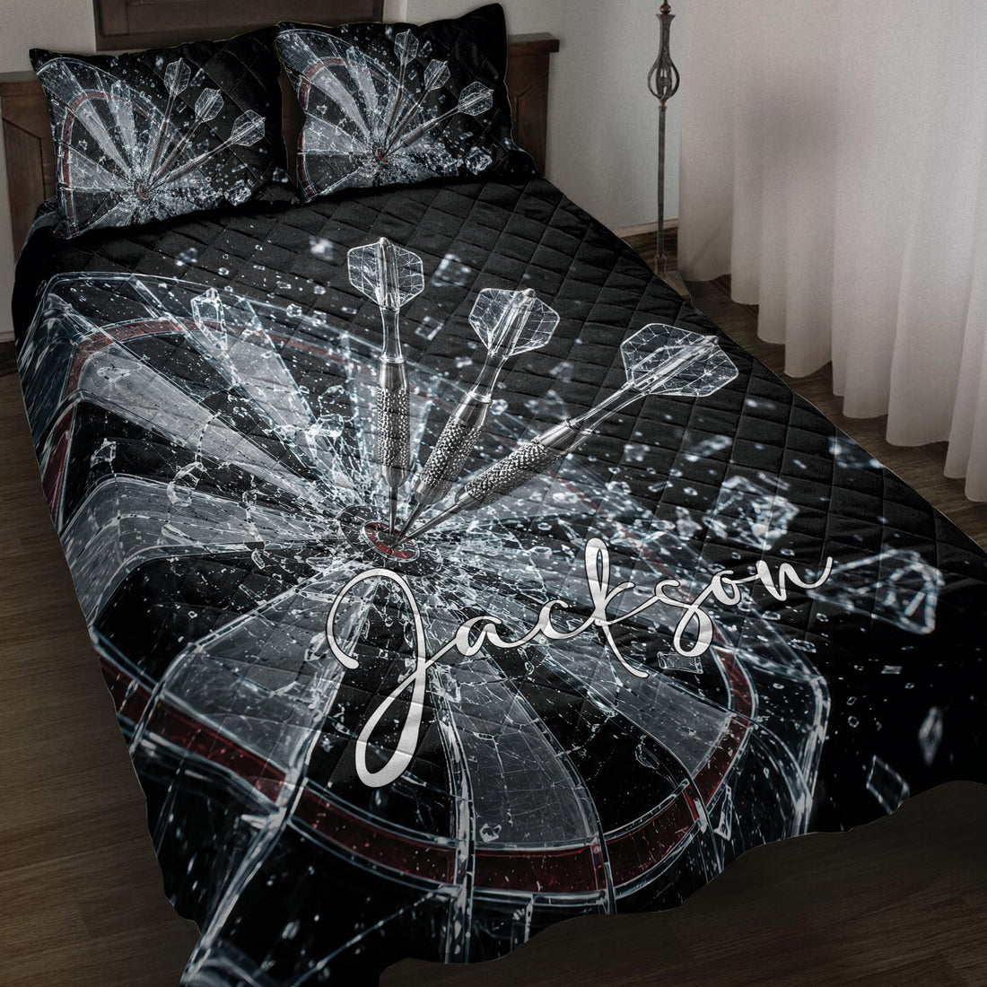 Black dartboard quilt blanket displayed on a bed with dramatic shattered glass and dart artwork