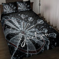 Black dartboard quilt blanket displayed on a bed with dramatic shattered glass and dart artwork