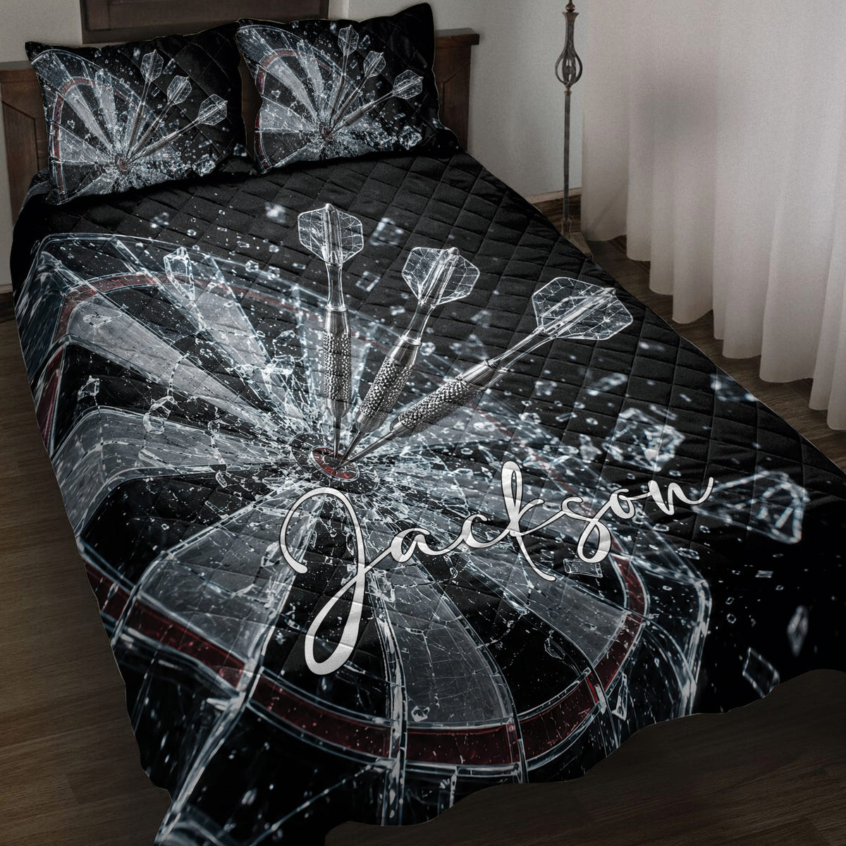 Black dartboard quilt blanket displayed on a bed with dramatic shattered glass and dart artwork
