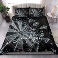 Dartboard quilt bedding styled in a bright bedroom with bold black, silver, and red artwork