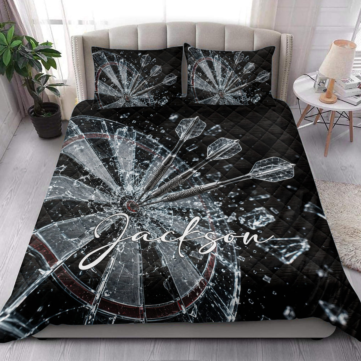 Dartboard quilt bedding styled in a bright bedroom with bold black, silver, and red artwork