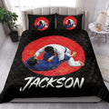 Jiu jitsu quilt blanket styled on a modern bed with bold black, red, and white artwork