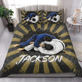 Jiu jitsu quilt blanket styled in a bright bedroom with black, gold, blue, and white artwork