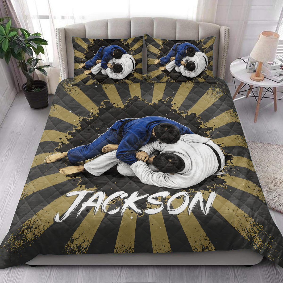 Jiu jitsu quilt blanket styled in a bright bedroom with black, gold, blue, and white artwork