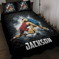 Black wrestling quilt blanket displayed on a bed with two grapplers in red and blue singlets
