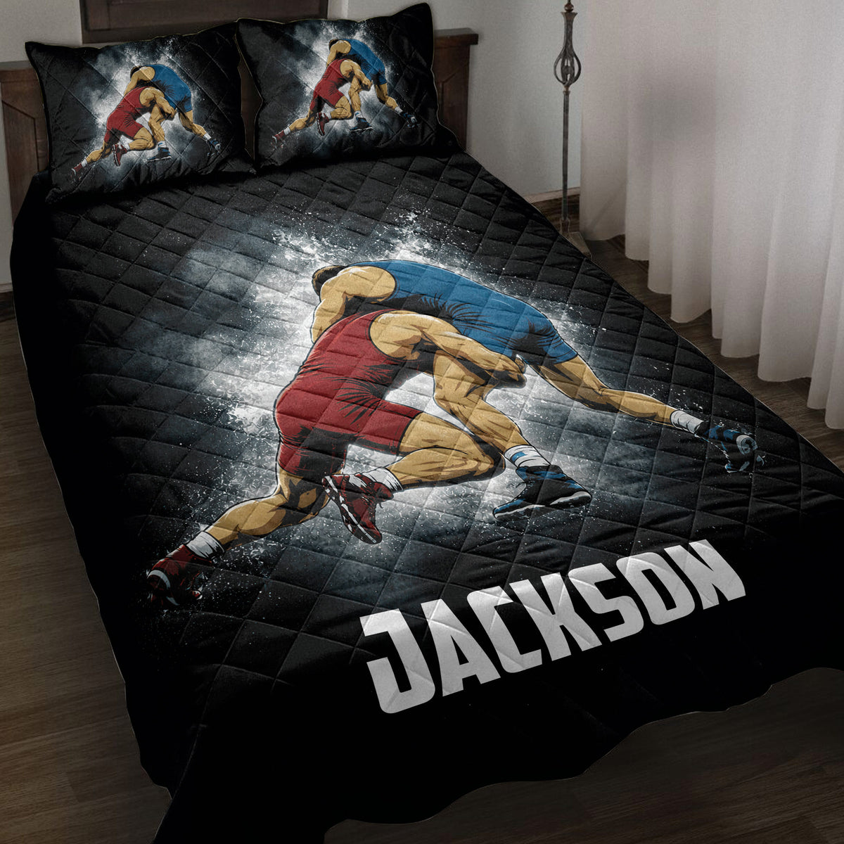 Black wrestling quilt blanket displayed on a bed with two grapplers in red and blue singlets