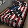 Close bedroom view of a wrestling quilt blanket with dramatic black wrestler silhouettes