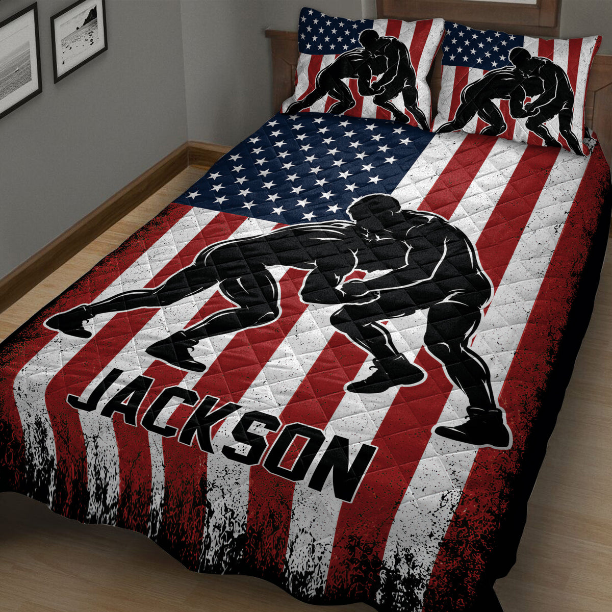 Close bedroom view of a wrestling quilt blanket with dramatic black wrestler silhouettes