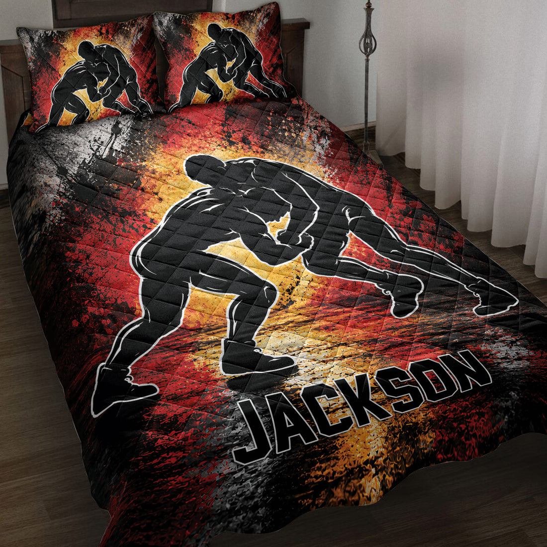 Wrestling quilt blanket displayed on a bed with grappling silhouettes and bold red, black, and gold artwork