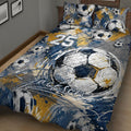 Close bedroom view of a soccer quilt blanket featuring sketch-style balls and energetic paint splashes