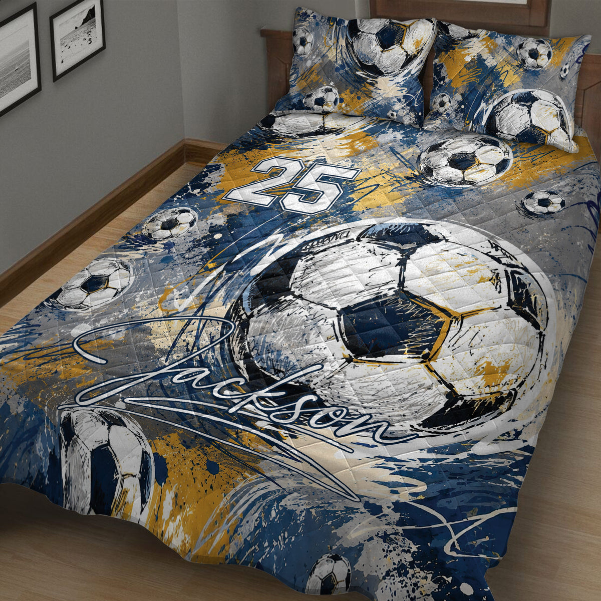 Close bedroom view of a soccer quilt blanket featuring sketch-style balls and energetic paint splashes
