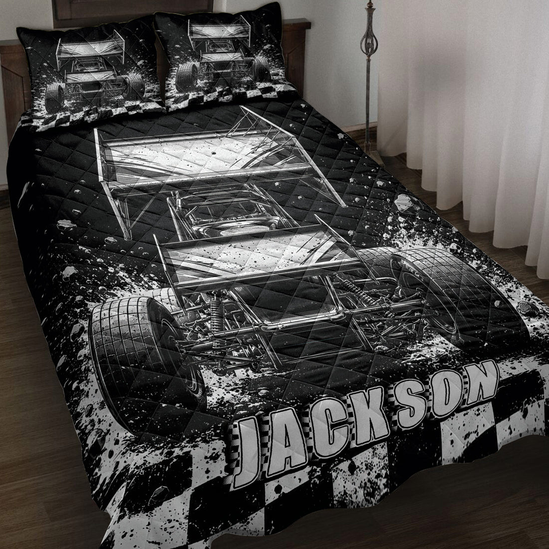 Black and white dirt track racing quilt blanket displayed on a bedroom bed with sprint cars and checkered flags