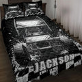 Black and white dirt track racing quilt blanket displayed on a bedroom bed with sprint cars and checkered flags