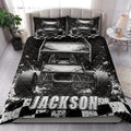 Dirt track racing quilt blanket styled on a bed with large sprint car artwork and checkered flag accents