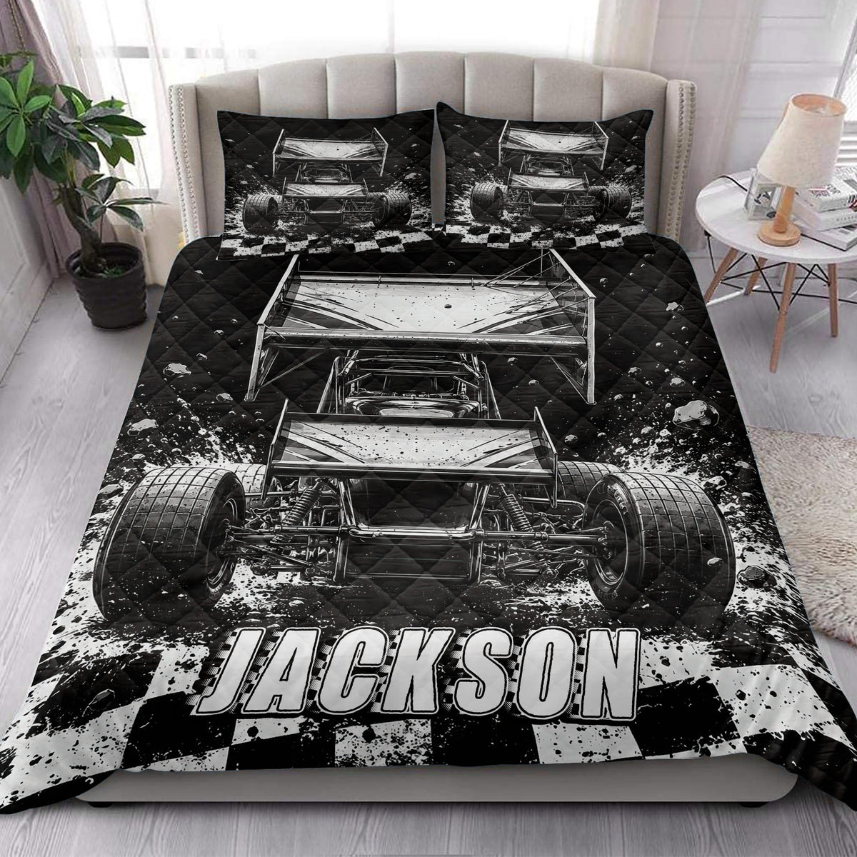 Dirt track racing quilt blanket styled on a bed with large sprint car artwork and checkered flag accents