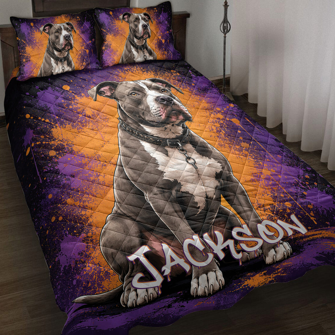 Pitbull quilt blanket displayed on a bed with purple and orange splatter artwork