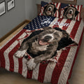 Angled bedroom view of a red, white, and blue pitbull quilt with large dog portrait artwork
