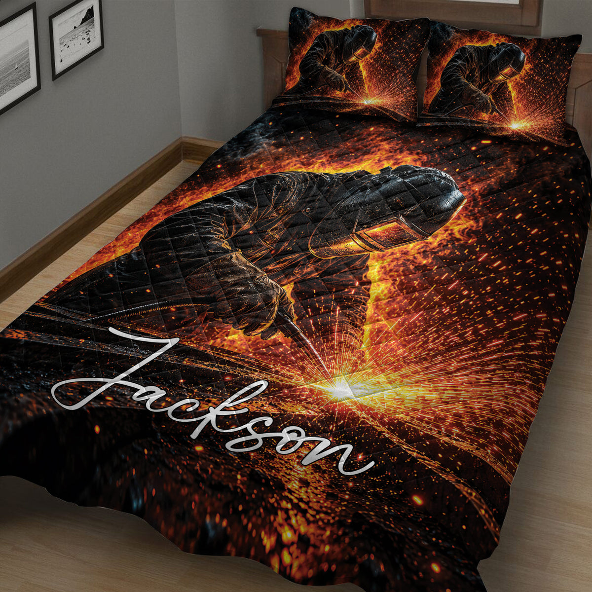 Close bedroom view of a black welder quilt blanket featuring glowing sparks and a welding scene
