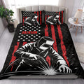 Welder quilt blanket styled on a bedroom bed with bold patriotic-inspired artwork