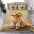 Goldendoodle quilt blanket styled in a bright bedroom with a large curly dog portrait