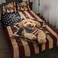 Goldendoodle quilt blanket displayed on a bed with patriotic stars and red, white, and blue artwork