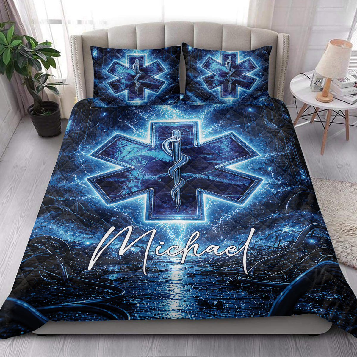 Blue EMS paramedic quilt styled in a bright bedroom with Star of Life medical artwork