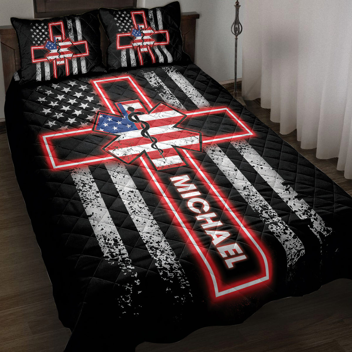 Paramedic quilt blanket displayed on a bed with bold black, red, white, and blue EMS artwork