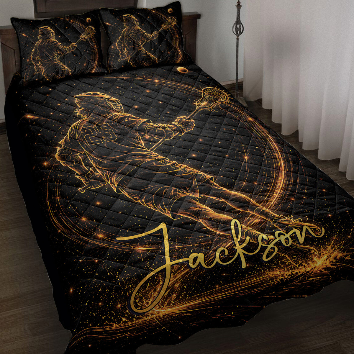 Black and gold lacrosse quilt blanket displayed on a bed with matching player artwork
