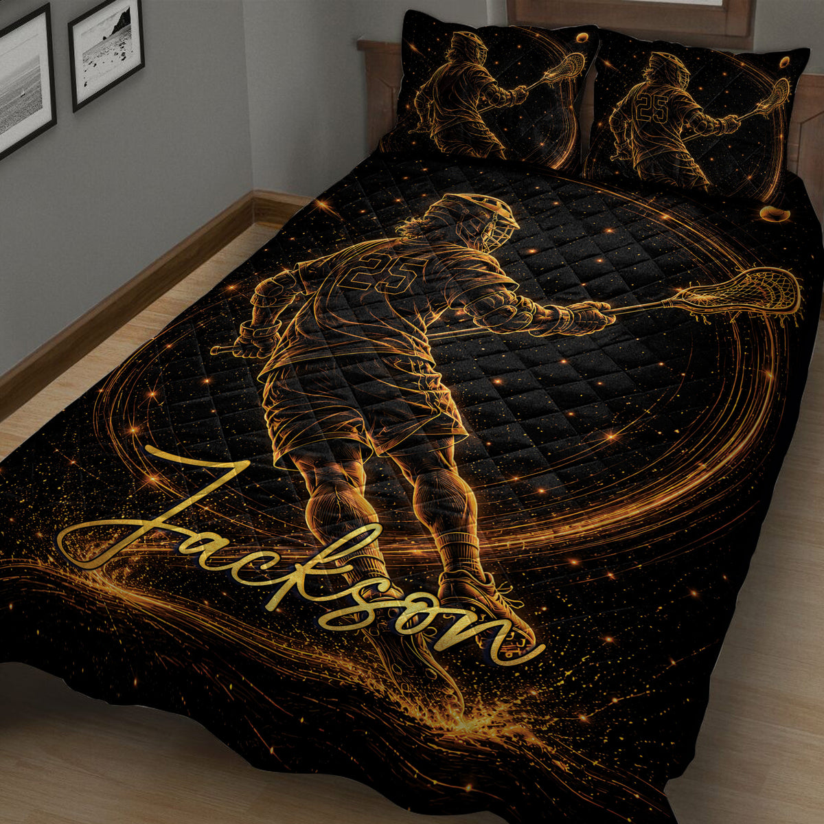 Close bedroom view of a black lacrosse quilt blanket with dynamic golden player artwork