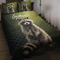 Raccoon quilt blanket displayed on a bed with matching raccoon pillow designs in dark green tones