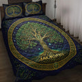 Tree Of Life quilt blanket displayed on a bed with green branches, golden roots, stars, and Celtic borders