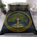 Tree Of Life quilt blanket styled in a bright bedroom with matching tree artwork across the bed
