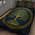 Close bedroom view of a Tree Of Life quilt blanket with green leaves, golden branches, and starry blue background